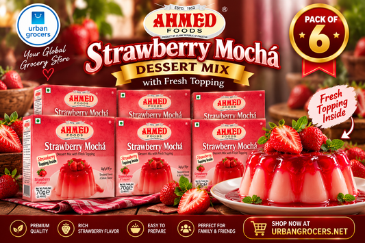 Six boxes of Ahmed Strawberry Mochá dessert mix with strawberry-topped dessert serving suggestion